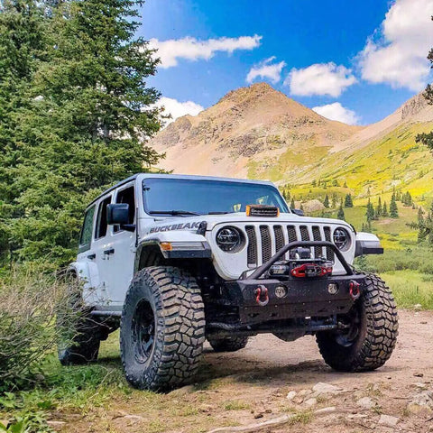 Off-road vehicle equipped with heavy duty D ring shackles 58000 lbs capacity tow shackle with seven eighth inch pin and washers.