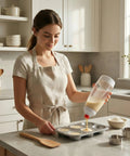 Woman using Two Pack Pancake Batter Dispenser Bottles, 1000ml Capacity, Mess Free Pouring For Pancakes, Muffins, Cupcakes And More in kitchen