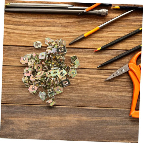 Premium Gold U Shaped Automotive Fasteners 50 Piece Set Replacement Panel Mounting Clips on wooden table with tools.