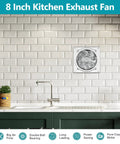 Heavy Duty Eight Inch Metal Exhaust Fan Pumpin Five Seven Six Cfm Airflow mounted in a modern kitchen wall, showcasing sleek design.