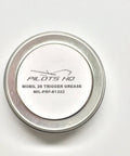 Top view of a quarter-ounce gun grease tin labeled as MIL-PRF-81322, suitable for triggers and small firearms.