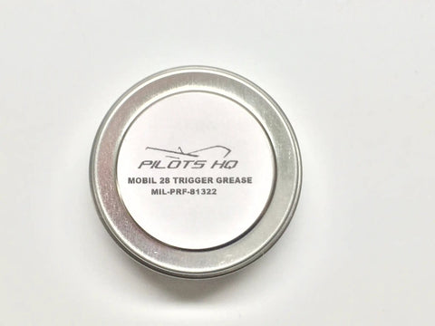 Top view of a quarter-ounce gun grease tin labeled as MIL-PRF-81322, suitable for triggers and small firearms.