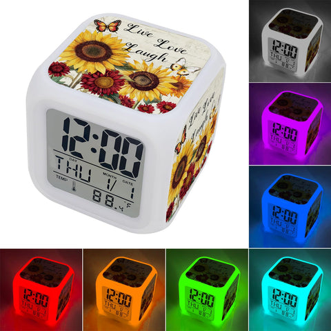 Total Game Changer Farmhouse Sunflower Butterfly Digital Cube Clock With Led Time Date Temp Readout, showing colorful light options.