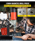 Beefy 1200W Magnetic Drill Press With 40mm Capacity and 13000N Hold, Stepless 100 to 580 RPM, 2.17 Inch Drill Depth, 1.57 Inch Cut, Heavy Duty Mag Drill for Steel Tapping, Welding, and Rig Work in use on a workbench.