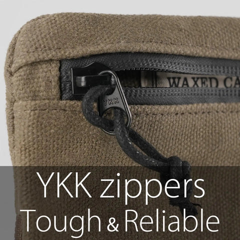 Close-up of YKK zipper on low profile belt zipper pouch for men and women, compact EDC waist pack, water resistant waxed canvas olive.