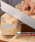 Foldable 9 Inch Kataba Pull Saw For Woodworking, 17 TPI SK5 steel blade cutting wood on a workbench.