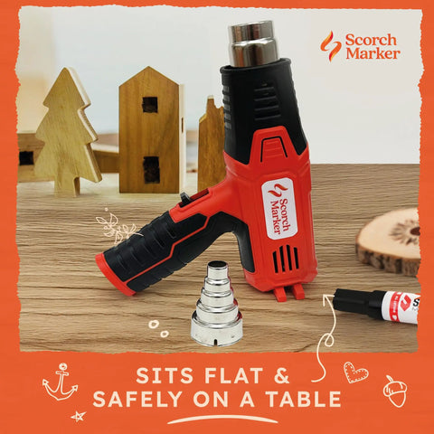 Powerful 1500 Watt Heat Gun for Crafting and Wood Burning with dual temperature settings, displayed with nozzle on table.