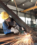 Worker using Flat Head Angle Grinder 4 1/2 to 5 Inch With 8 Amp Motor Aluminum Gearbox on metal beam in workshop