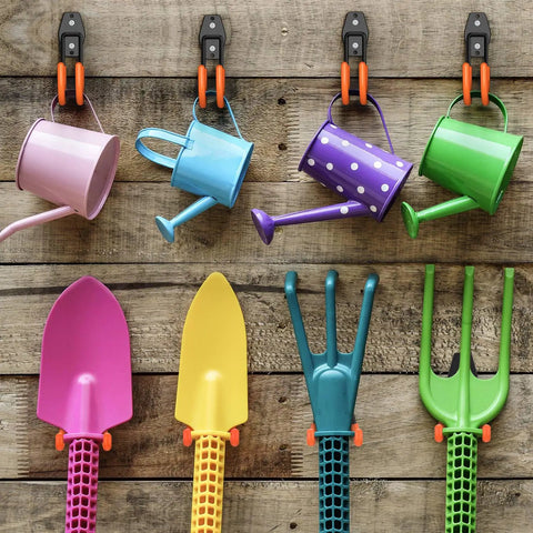 Heavy Duty Garage Hooks 4 Pack J Shaped Wall Mounted Hanger Organizer holding colorful watering cans and garden tools