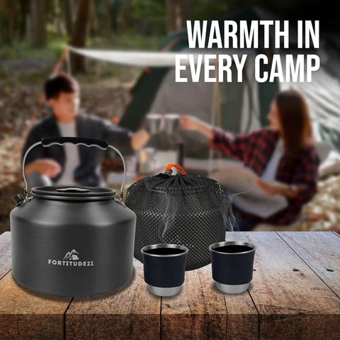 Stovetop Camping Kettle 2.2 Liter Teapot for Boiling Water and Tea Brewing, Go To Camp Kitchen Kettle with two cups on a table.