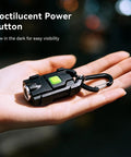 Ultra Bright 500 Lumen USB Rechargeable Small Flashlight Keychain Light with glowing power button held in a hand