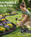 Woman installing Flexible No Dig Garden Edging Kit 33 Ft By 2 In Plastic Landscape Border With 45 Stakes for flower beds in yard