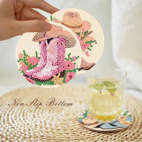 Hand holding 8 Pcs Cowboy Boots Diamond Art Coaster Kit For Adults Beginners Diy Craft Lovers with floral design and drink