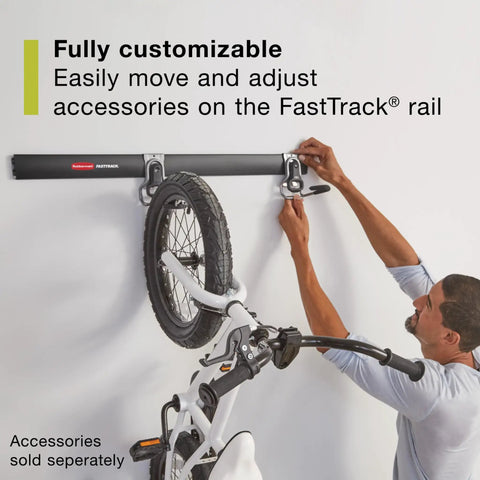 Person installing FastTrack 24 Piece Garage Wall Mounted Storage Kit with 6 Rails and 18 Hooks holding a bicycle