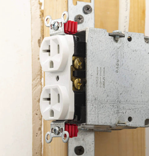 GSP-24 24 Piece Twist-Apart Switch And Receptacle Spacers attached to electrical outlet, showing red pro grade spacers