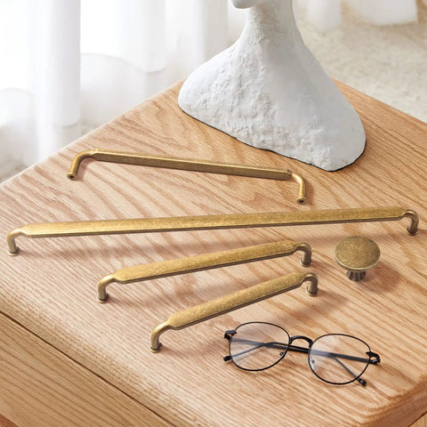Six Pack Antique Brass Cabinet Pulls Set With 6-1/4 Inch Hole Center And 6.7 Inch Length Zinc Alloy Drawer Handles Includes Two M4 Screws 1 Inch And 1.5 Inch Great For Kitchen Cabinets And Drawers displayed on wooden table with glasses