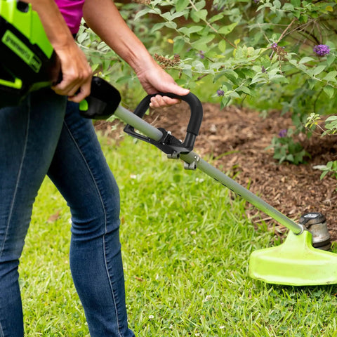 Person using a Universal Loop Handlebar Mounting Hardware Kit For Weed Trimmer And Lawn Care, showing rubber-coated handlebar.
