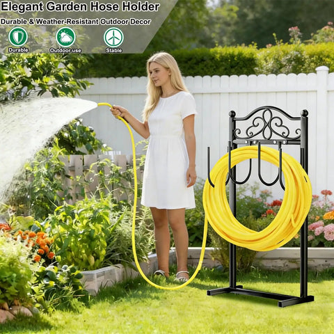 Built Tough Heavy Duty Garden Hose Holder With Four Stabilizing Spikes Freestanding Metal Hose Stand For Up To 100 Ft Of Hose Yard Lawn And Outdoor Garden Black in garden with woman watering plants