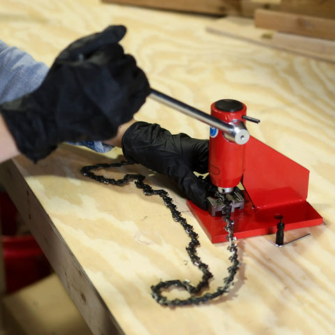 Heavy Duty Chainsaw Chain Breaker And Rivet Tool Kit for Quick Link Removal and Rivet Punching on a Stable Workbench in action