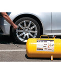 Hi-Viz 11-Gallon Horizontal Portable Air Tank with Tire Air Chuck by car, ideal for roadside tire inflation, includes safety bypass.