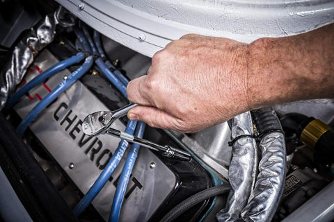 Using Three Eighth Inch Drive Ratchet And Drive Tools Set With Eighty Four Tooth Full Polish Chrome Ratchets on engine