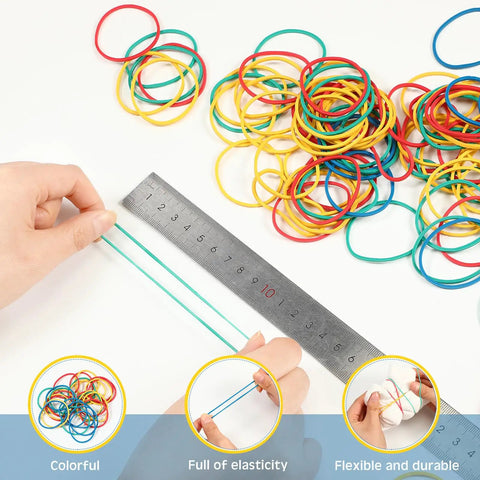 Hands measuring colorful rubber bands with a ruler from 2000 Piece Tie Dye Rubber Band Kit With 200 Pairs Gloves And 200 Sealed Bags.