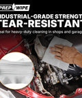 Hand using Prep Wipe White Lint Free Cleaning Towels 300 Sheets 10 by 14 Inches for engine cleaning in garage.