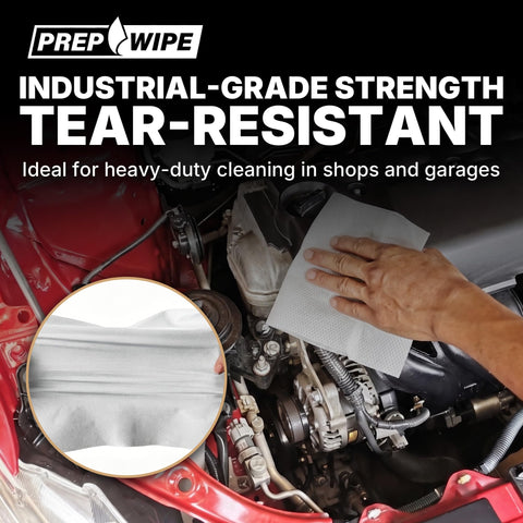 Hand using Prep Wipe White Lint Free Cleaning Towels 300 Sheets 10 by 14 Inches for engine cleaning in garage.