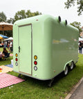 Kickstart Your Food Truck Hustle With This Turnkey Mobile Kitchen Trailer Featuring Plug And Play Electrical And Nsf Stainless Steel Counters Perfect For Sliders Coffee And Quick Cash Flow - rear view at outdoor festival.