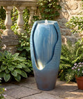 32 Inch Outdoor Jar Water Fountain With LED Lights, Vintage Blue Cracked Jar Design, Cascading Waterfall near garden plants