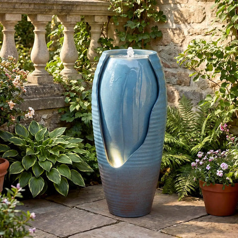 32 Inch Outdoor Jar Water Fountain With LED Lights, Vintage Blue Cracked Jar Design, Cascading Waterfall near garden plants