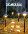 Bronze finish 4 Pack Low Voltage Path Lights Kit With 2W LEDs 100 Lumen Warm White 2700K in wet evening garden path