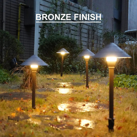 Bronze finish 4 Pack Low Voltage Path Lights Kit With 2W LEDs 100 Lumen Warm White 2700K in wet evening garden path