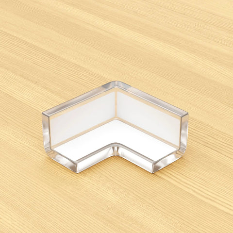 Hella Secure Baby Proofing Pack Featuring Clear Pvc Edge And Corner Guards strong corner bumper on wooden table for toddler safety.