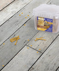 Container of exterior wood screws size ten by two inches with T25 star Torx drive deck screws 466 piece set on wooden deck.