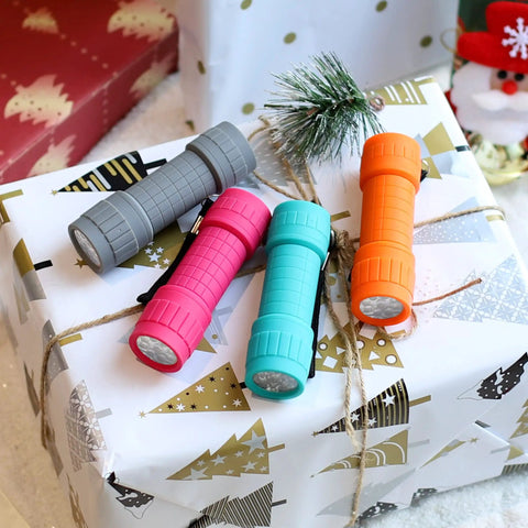 10 Pack Nine LED Mini Flashlights With AAA Batteries Included And Pre Installed displayed on gift box.