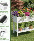 Raised Garden Bed On Wheels With Storage Shelf And Water Level Monitor, elevated planter with flowers, grayish white in garden