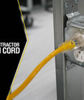 Rugged Heavy Duty Outdoor Extension Cord With Lighted End For Tools And Equipment 100 Foot 14 Gauge SJTW Jacket Plugged into Outlet
