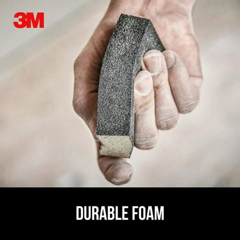 Hand holding Drywall Sanding Sponge Set 2 Pack Dual Grit Block Fine And Medium Grits for removing and smoothing joint compound