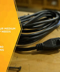 Rugged Indoor Outdoor Extension Cord 15 Foot Heavy Duty 3 Prong With Vinyl Jacket Molded Plugs And Reinforced Blades For Tough As Nails Durable Safe Power Inside And Outside coiled on a workbench.