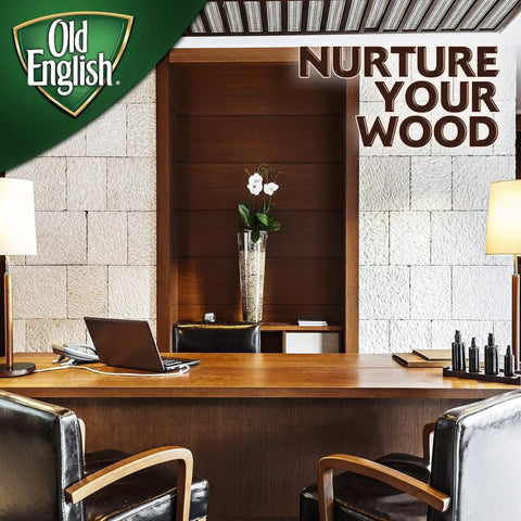 Office space with wooden furniture, desk, chairs, and decor, featuring text 'Nurture Your Wood' with Old English logo in corner.