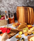 Kigley 10-piece acacia wood cutting boards set; grooved boards on a kitchen counter with bread, fruit, and watermelon.