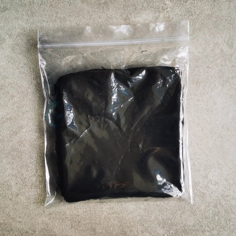 Emergency Fire Starter Kit With Char Cloth, Ultra Lightweight 12 Pack shown in sealed plastic bag, each piece 4x4 inch.