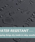 Close-up of water droplets on fabric of 3x6 Ft Outdoor Storage Shelter Heavy Duty Waterproof Portable Shed With Roll Up Zipper Door And Ventilated Windows For Motorcycle Bike Tools Gray Backyard Storage, showcasing water resistance.