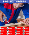 Man applying Non-Toxic All-Purpose Wood Glue For Woodworking And Crafts, Crystal Clear Dries Fast, on wooden boards