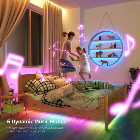Child and adult jumping on bed with DreamColor LED Strip Lights 16.4ft Music Sync RGB 5050 LED Tape creating colorful room ambiance.