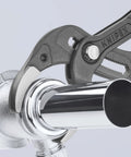 10 Inch Pipe And Connector Pliers With Push Button 25 Easy Adjustments gripping a metal pipe fitting