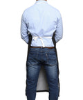 Back view of person wearing 25 Pack Rubber Vinyl Aprons Large 27W X 42L Waterproof Pro-Grade Halter Bib Aprons For Dishwashing Butcher Lab