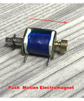 12V Solenoid Electromagnet Push Pull Type For Linear Motion Control, showing mounting hole and blue coil, on a grey surface