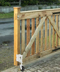 Spring Loaded Gate Caster Wheel For Wooden Gates And PVC Fences Workhorse 4 Inch Gate Wheel With 360 Degree Mount attached to wooden gate